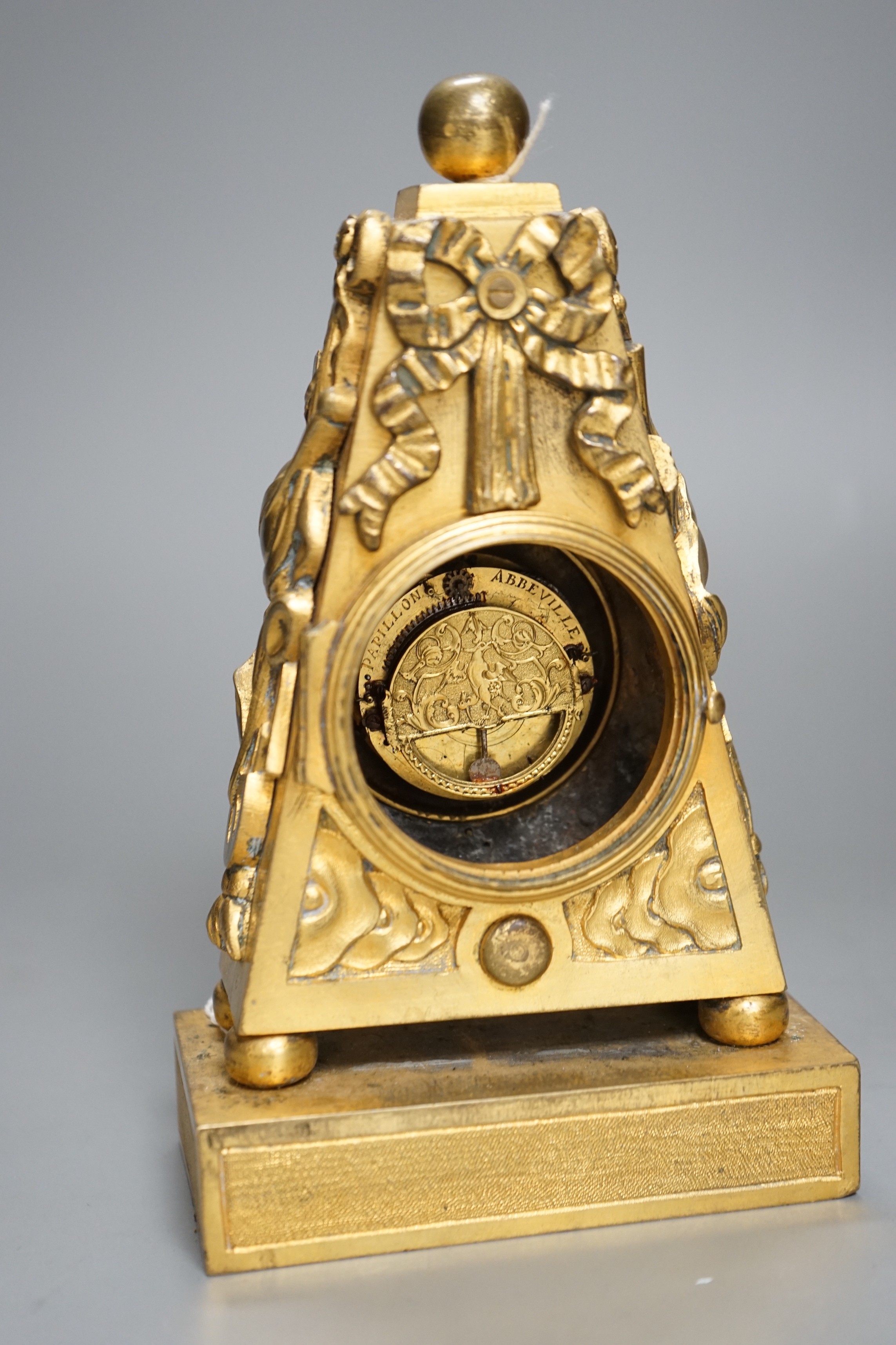 An 18th century French ormolu mantle timepiece with convex enamelled dial, 20cm